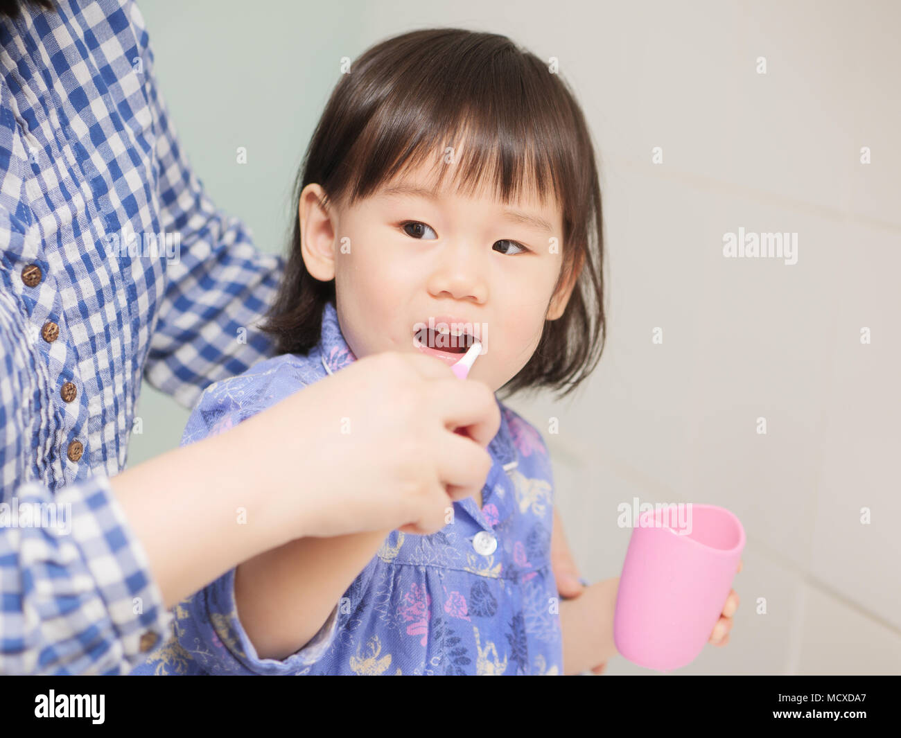 baby girl learn how to brush teeth Stock Photo Alamy
