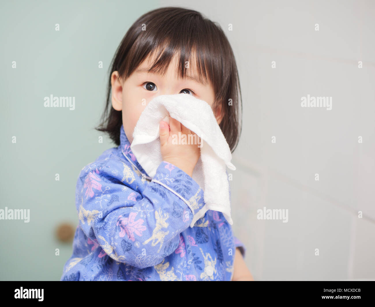 baby girl washing face by herself Stock Photo Alamy