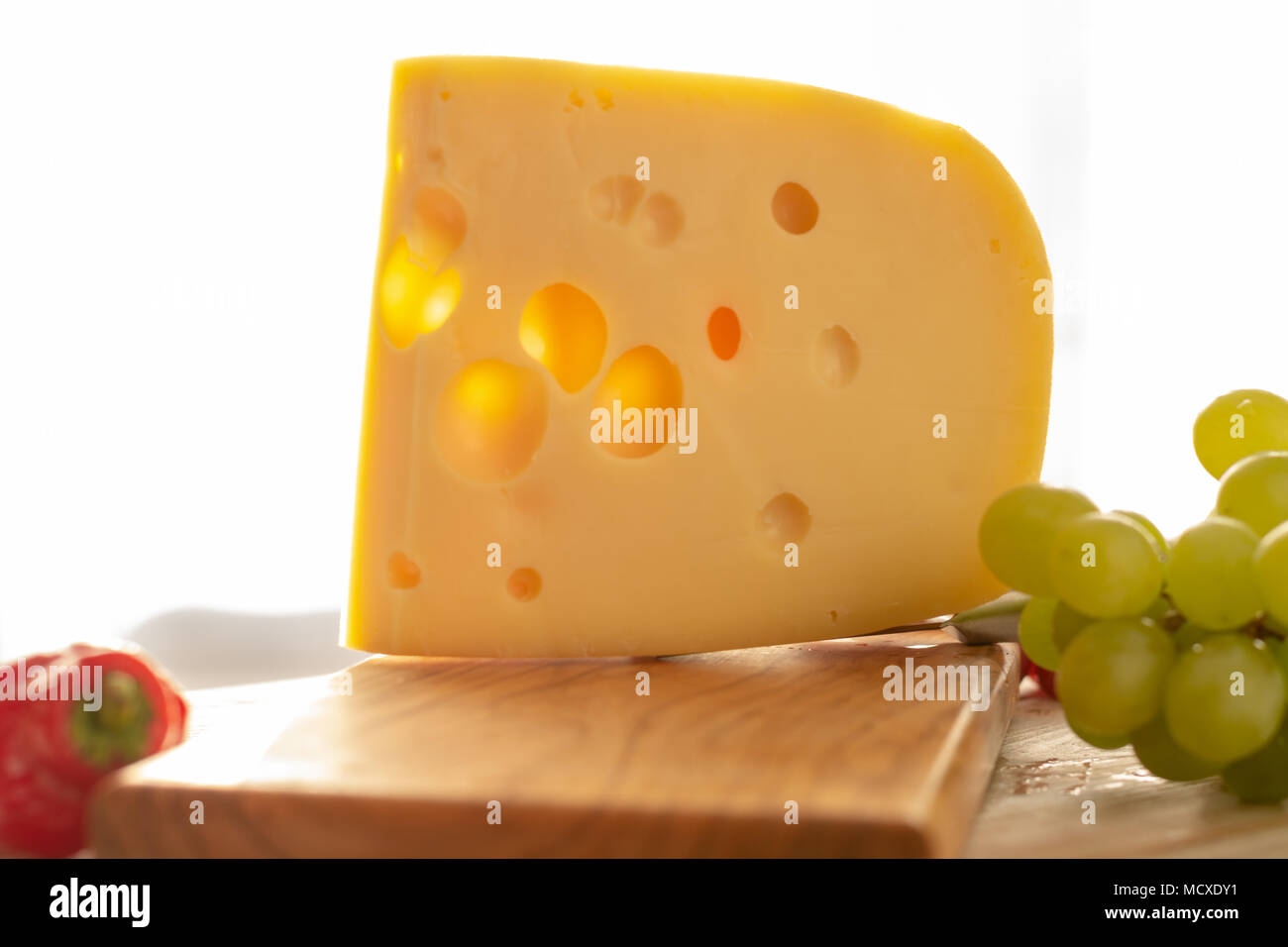 Dutch hard cheese Maasdam or Emmentaler, cheese with holes Stock Photo