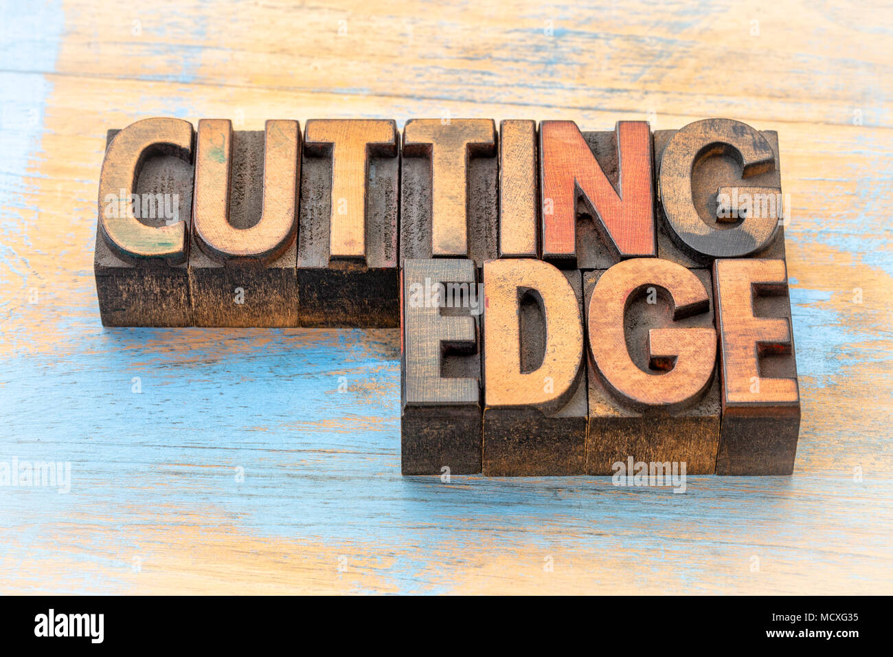 cutting edge word abstract in vintage letterpress wood type Stock Photo