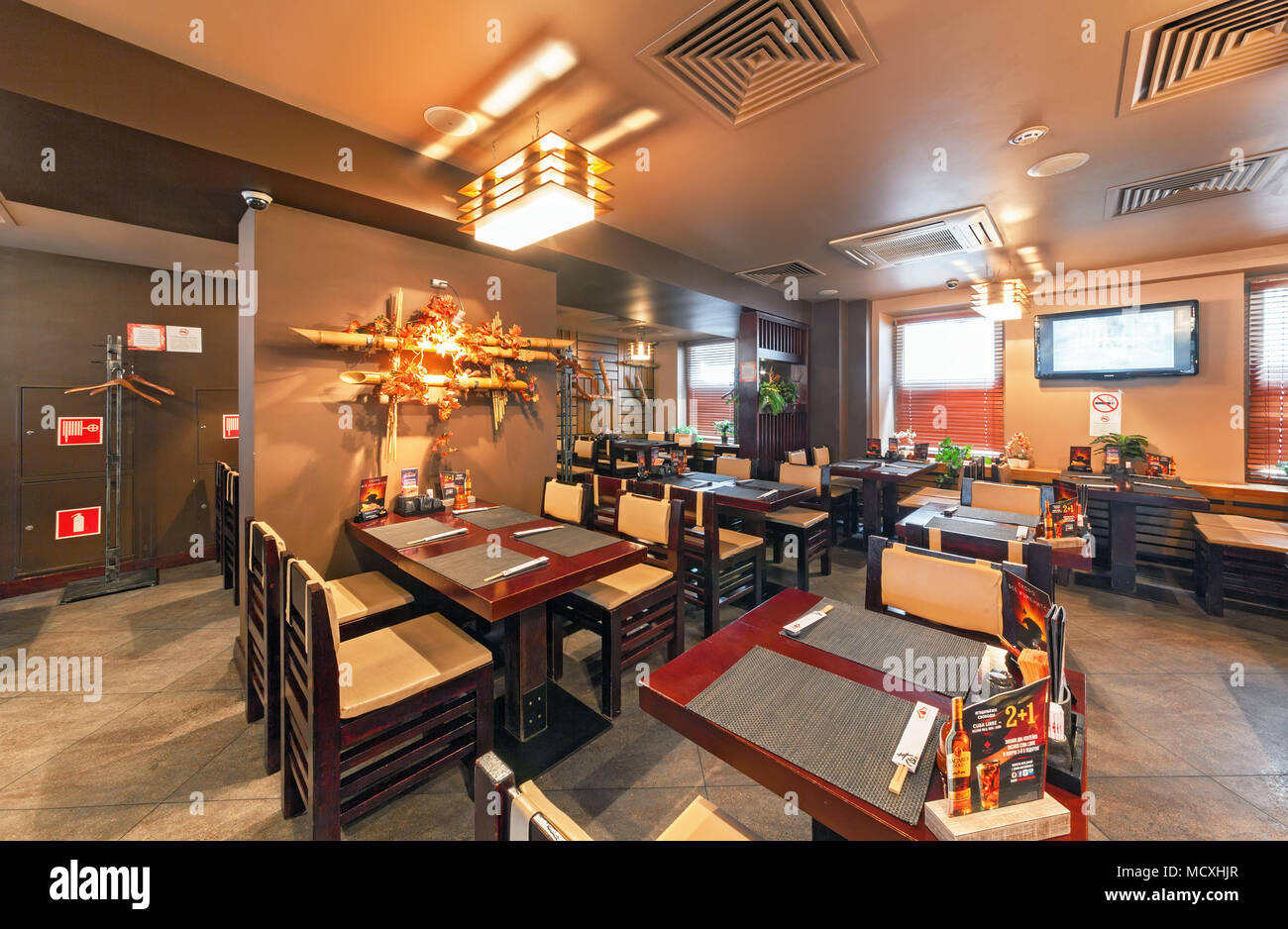 MOSCOW - SEPTEMBER 2014: Interior of the Modern Japanese restaurant 'Yakitoriya' decorated in the autumn theme. The main hall inside Stock Photo