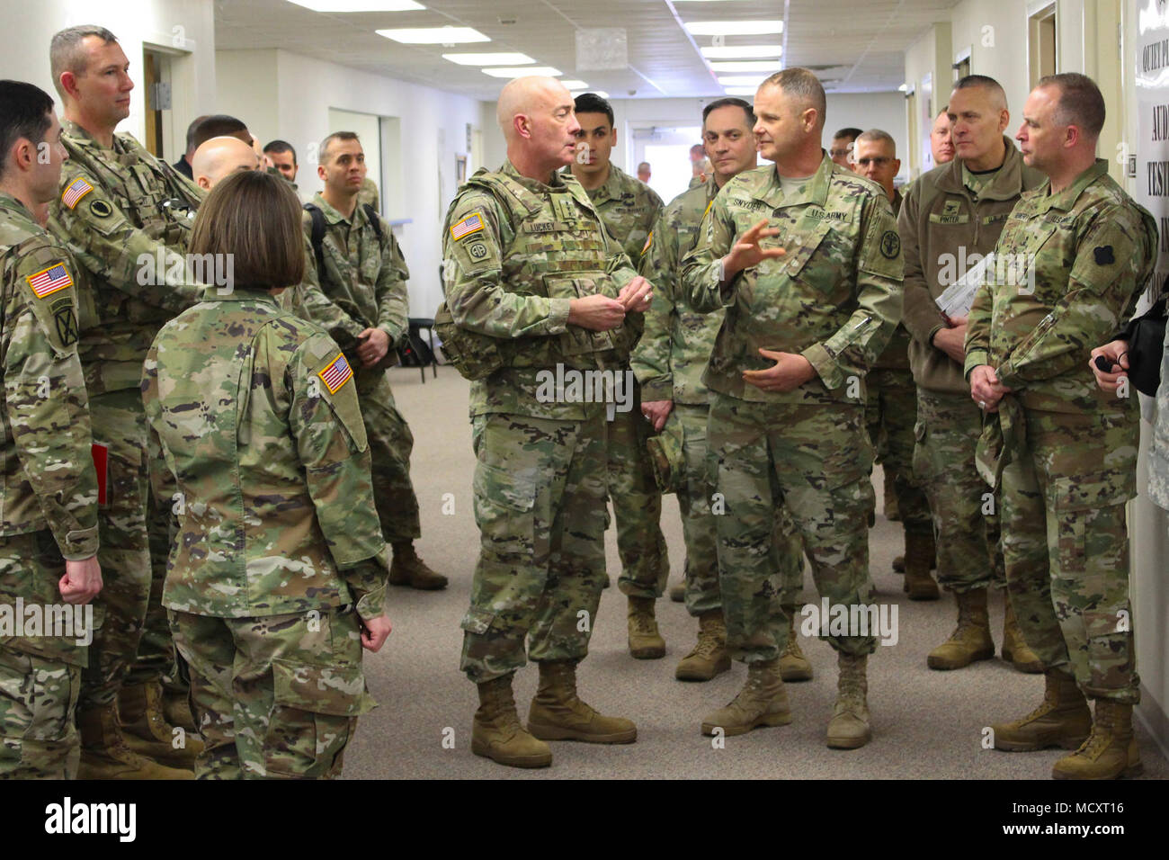 Lt. Col. Kevin Snyder, chief of ambulatory care, assigned to Blanchfield Army Community Hospital, discusses details of the multi-unit operation with Lt. Gen. Charles D. Luckey, U.S. Army Reserve Command Commanding General, March 11, 2018. Soldier Readiness Processing is a successful proof-of-concept program implemented by multiple Army Reserve Units with a mission of supporting a more medically ready fighting force.     Functionally aligned to U.S. Army Medical Command, ARMEDCOM is uniquely capable of simultaneously providing military hospital and clinic expansion, augmentation, blood donor se Stock Photo