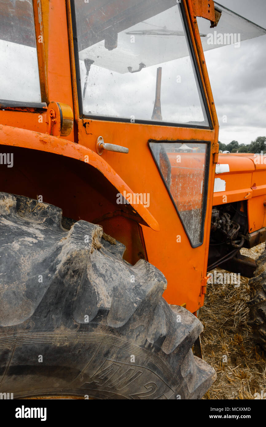 Tractor on grass field Stock Photo - Alamy