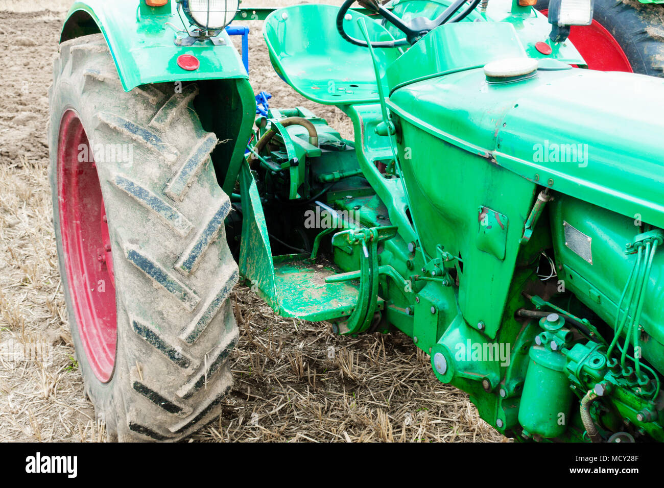 Tractor on field Stock Photo - Alamy