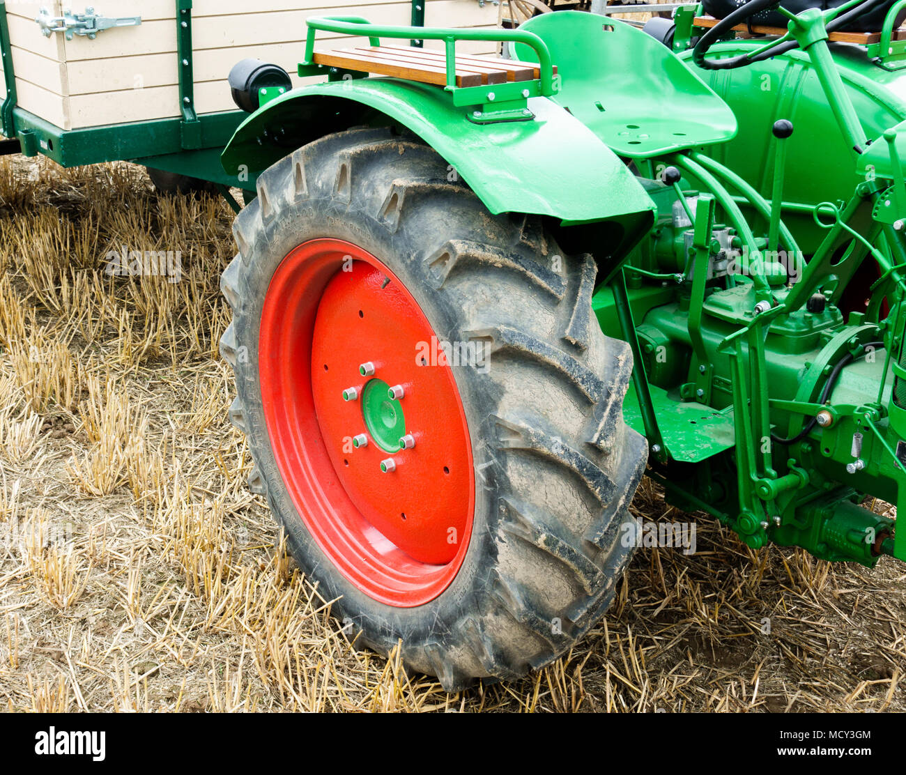 Tractor on grass field Stock Photo - Alamy