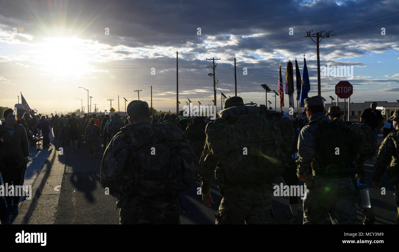 Servicemembers, families and civilians participate in the 29th Annual Bataan Memorial Death March on March 25, 2018 at White Sands Missile Range, New Mexico.  The Bataan Memorial Death March is a 26.2-mile run/ruck/walk event held annually to honor thousands of American and Filipino soldiers who defended the Philippines at the outbreak of World War II, particularly the 75,000 who surrendered to invading Japanese forces on April 9, 1942, and were marched by their captors over 60 miles through treacherous jungle terrain and into captivity and is considered to be one of the toughest marathon-leng Stock Photo