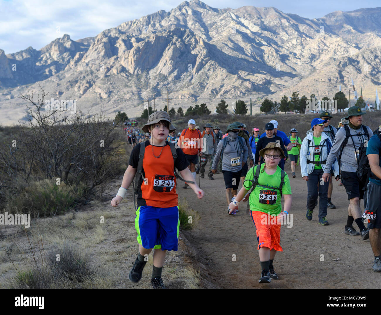 Servicemembers, families and civilians participate in the 29th Annual Bataan Memorial Death March on March 25, 2018 at White Sands Missile Range, New Mexico.  The Bataan Memorial Death March is a 26.2-mile run/ruck/walk event held annually to honor thousands of American and Filipino soldiers who defended the Philippines at the outbreak of World War II, particularly the 75,000 who surrendered to invading Japanese forces on April 9, 1942, and were marched by their captors over 60 miles through treacherous jungle terrain and into captivity and is considered to be one of the toughest marathon-leng Stock Photo