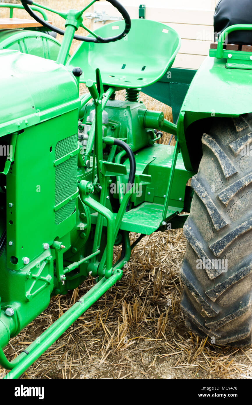 Tractor on grass field Stock Photo - Alamy