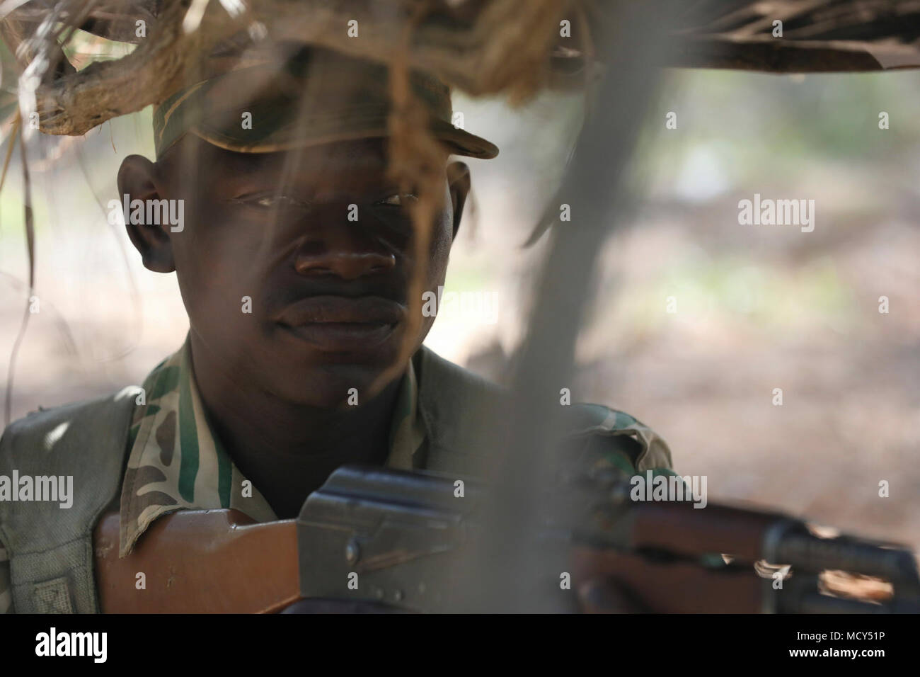 A Zambian soldier prepares to engage a target from a concealed position