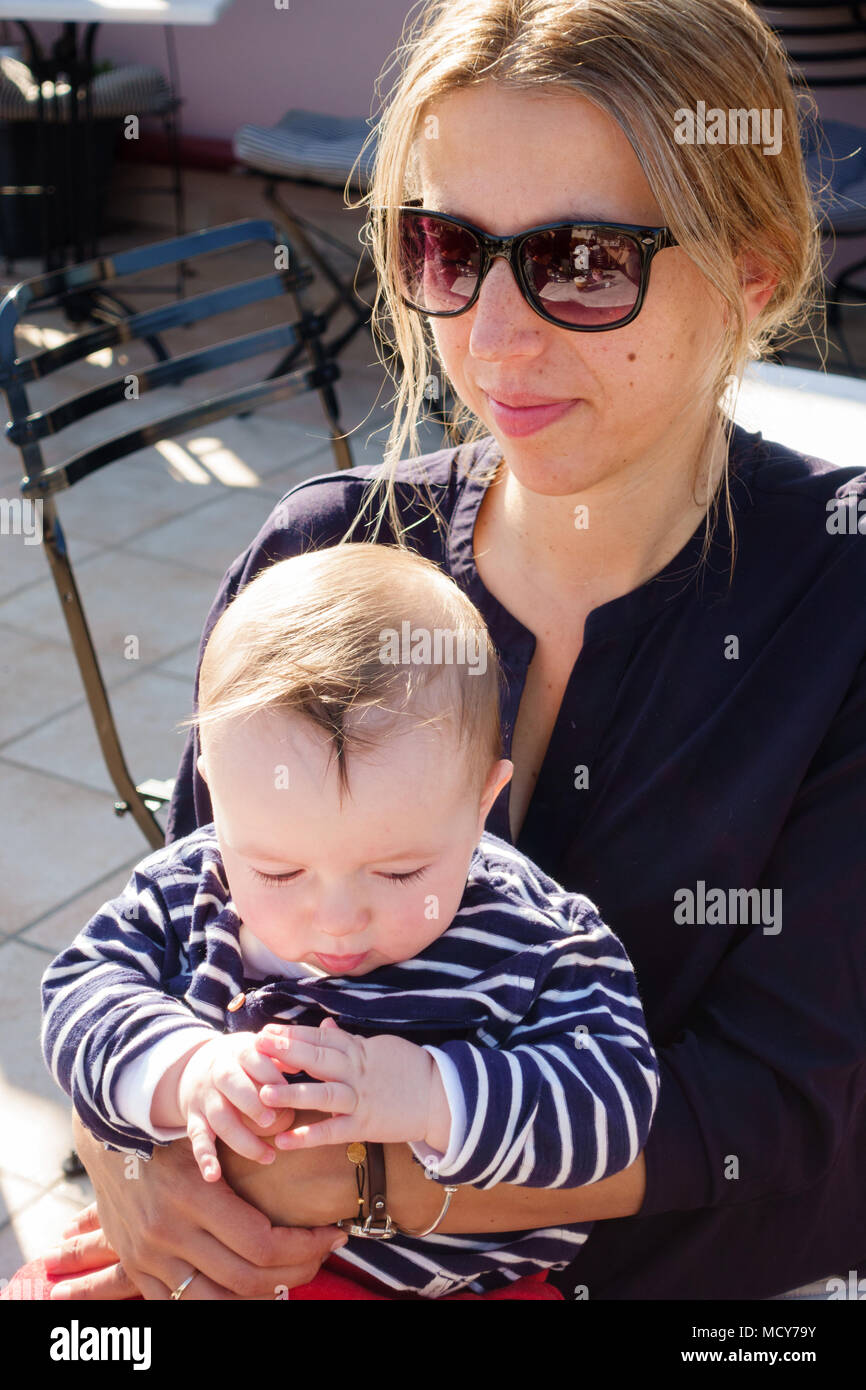 Mother and baby boy at a restaurant, Athens, Greece Stock Photo