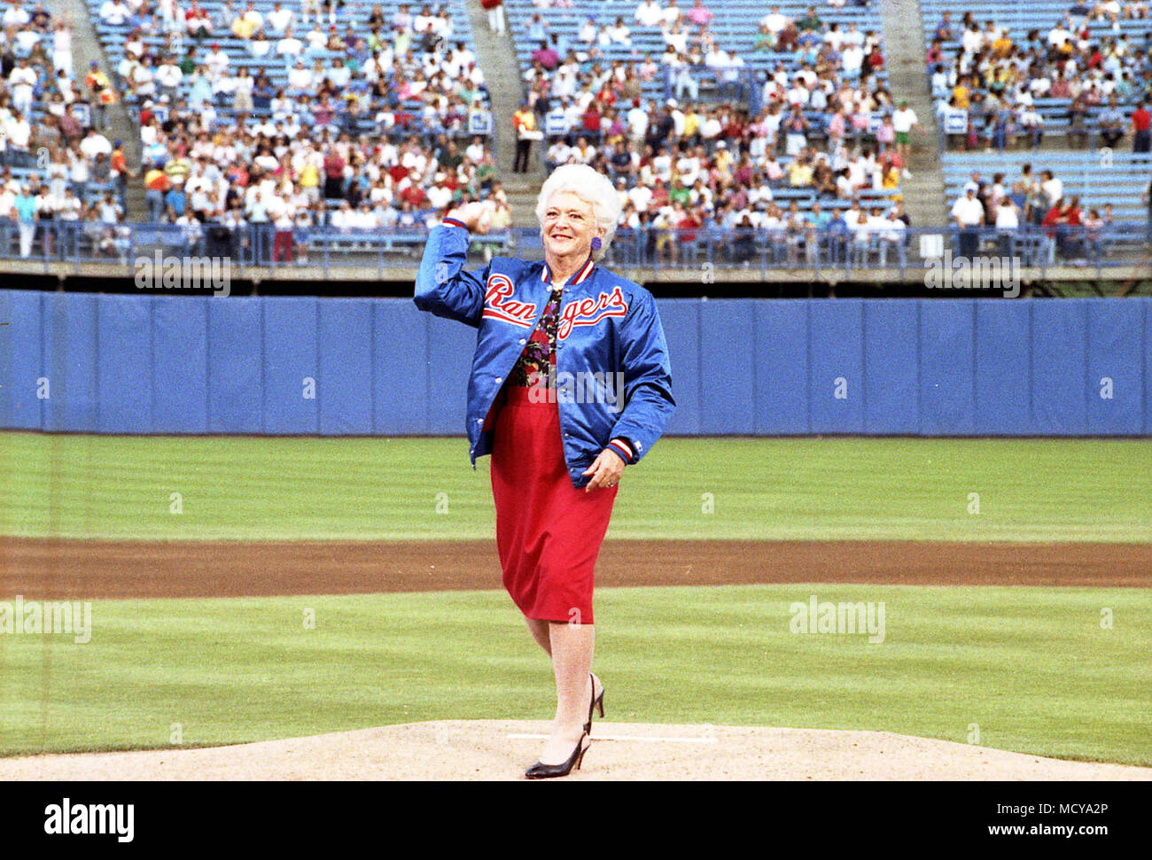 Mrs. Bush throws the ceremonial first pitch of a Texas Rangers baseball