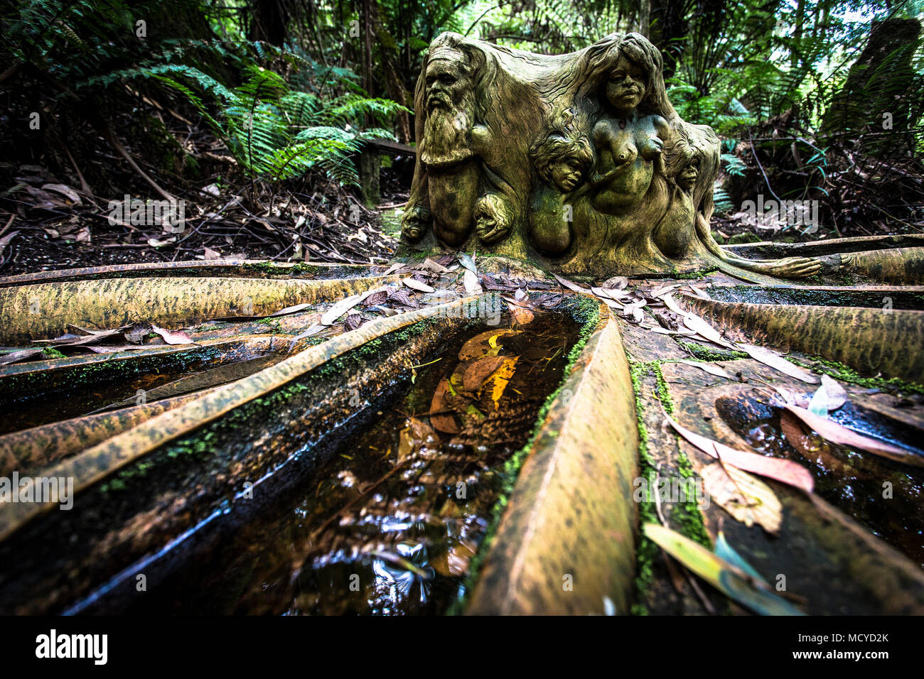 Figurine in forest of Dandenong mountain ranges of Melbourne Australia William Ricketts Australasia Stock Photo