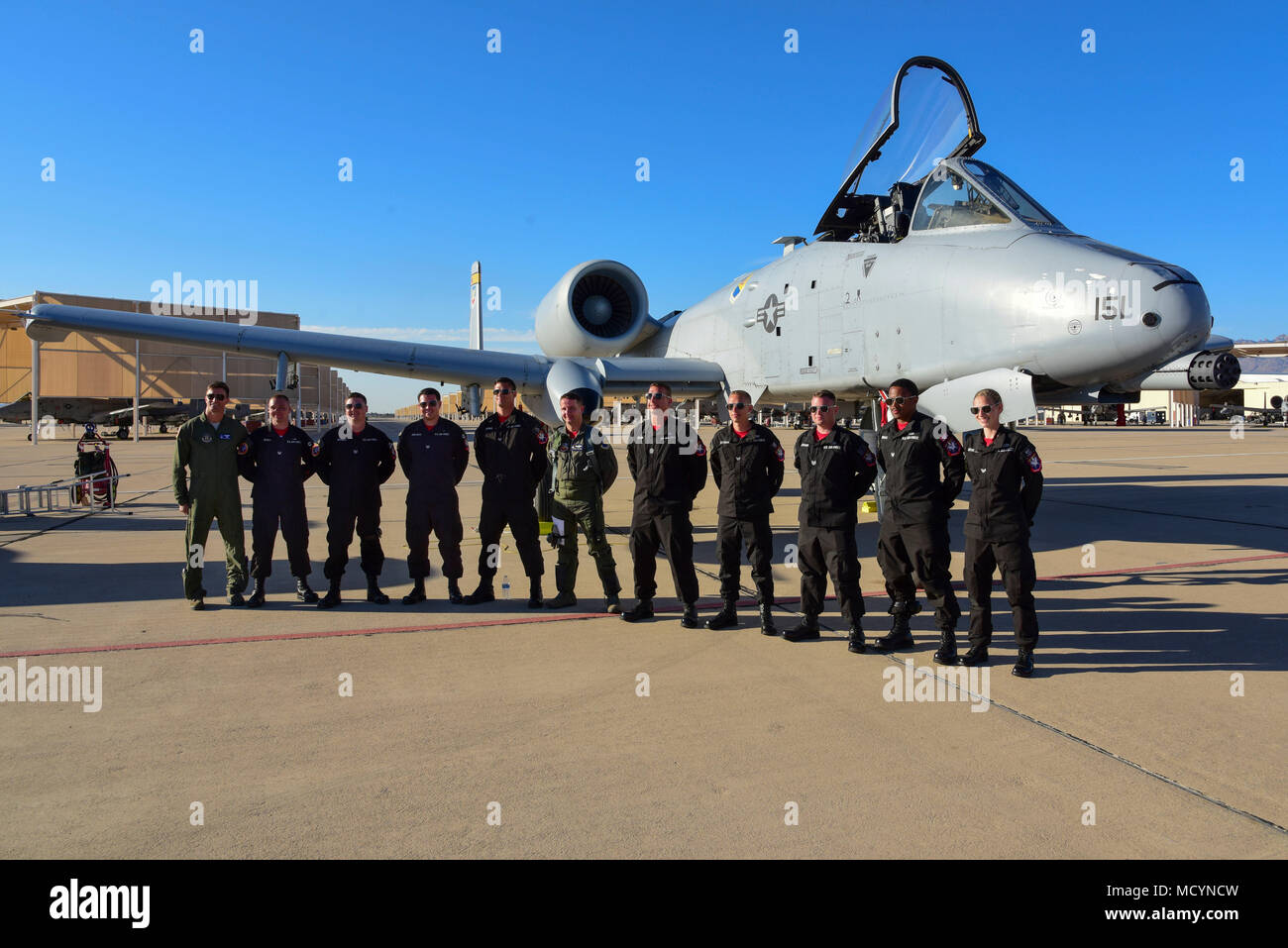 The A-10C Thunderbolt II Demonstration Team poses for a group photo after completing the final certification flight at Davis-Monthan Air Force Base, Ariz., March 1, 2018.  Gen. Mike Holmes, commander of Air Combat Command, signed off the A-10C Thunderbolt II Demonstration Team following the flight to officially make the team one of three ACC aerial demonstration teams. (U.S. Air Force photo by Senior Airman Betty R. Chevalier) Stock Photo