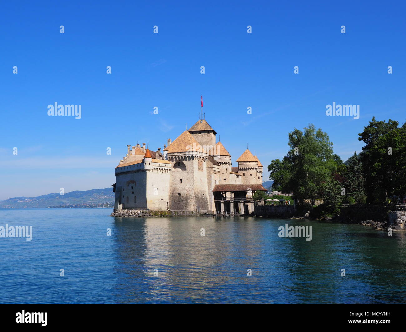Panorama of medieval Chateau de Chillon at Lake Geneva in Montreux city at Canton of Vaud in Switzerland, landscapes of alpine Lac Leman, clear blue s Stock Photo