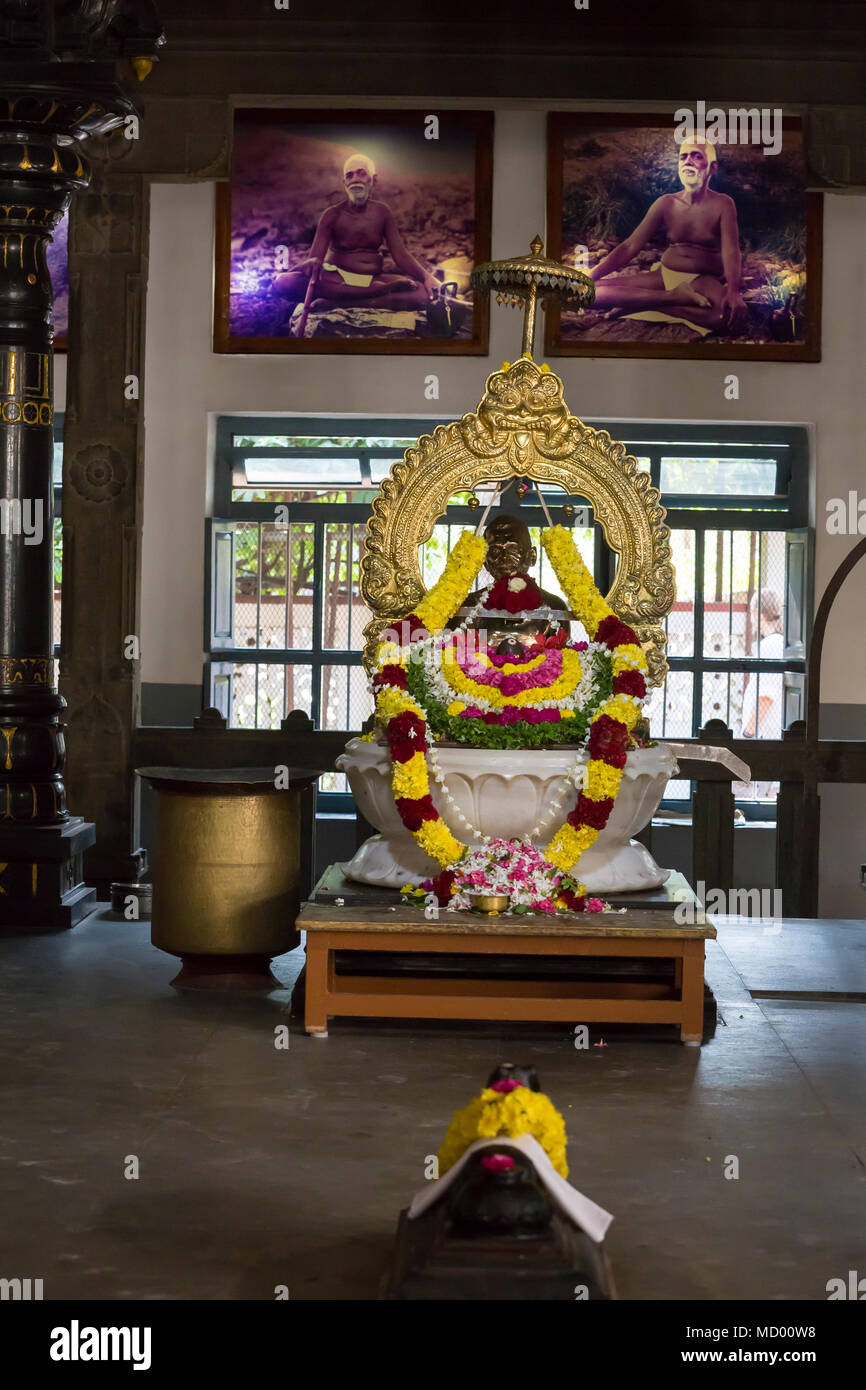 Ashram of Sri Ramana Maharshi, Tiruvannamalai, Tamil Nadu, India - March circa, 2018. Unidentified woman and man ceremony in the ashram to meditate, t Stock Photo