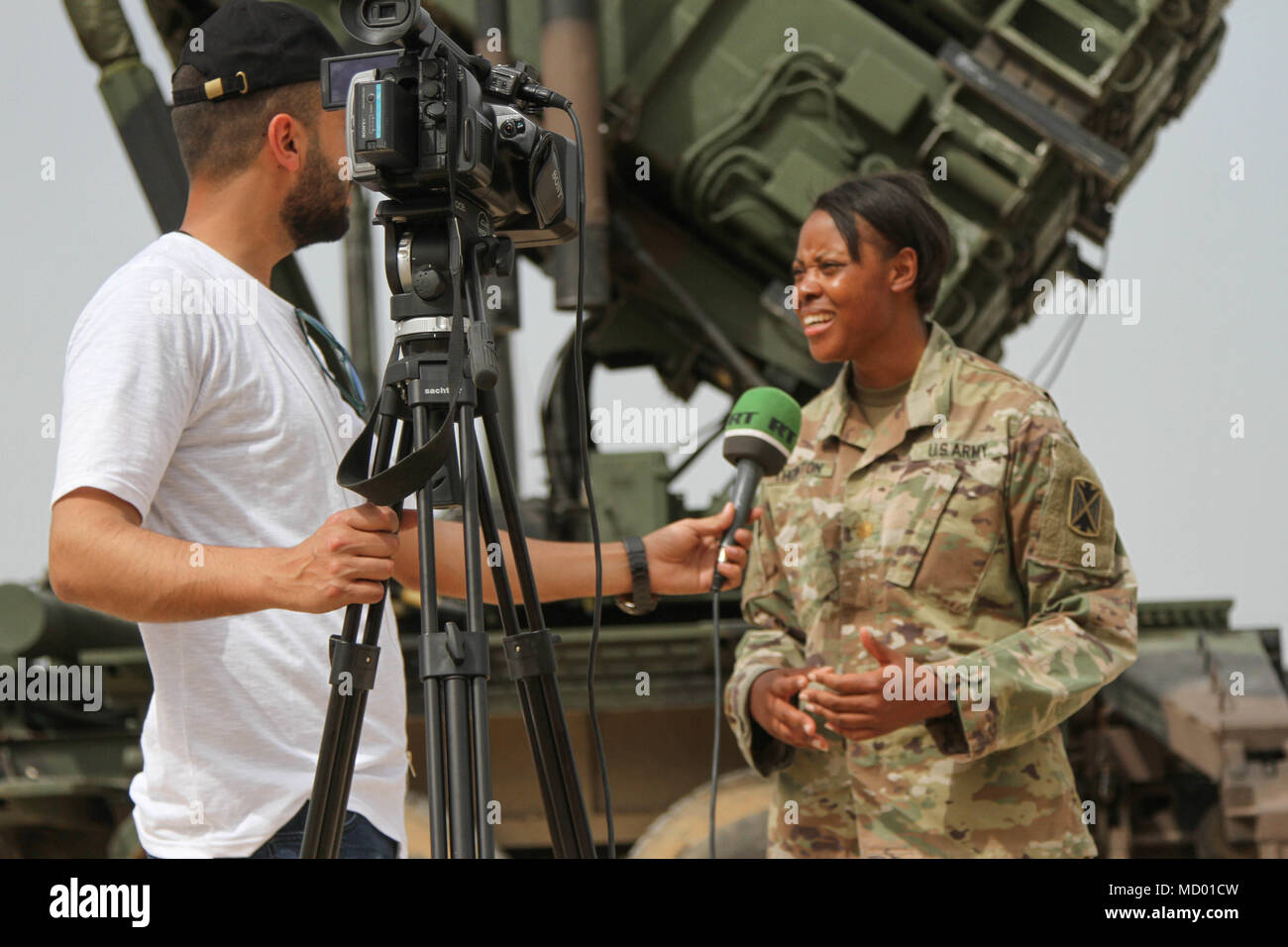 Maj. Mary Thornton, executive officer assigned to 5th Battalion, 7th Air Defense Artillery, talks with a news reporter from RT, Russian international television network during Juniper Cobra Media Day at Hatzor, Israel Mar. 8, 2018. Juniper Cobra 18 is designed to improve the shared defensive capabilities between the U.S. and Israel against any missile threats. (Photo by Jessica Colby, Delta Battery, 5-7 ADA) Stock Photo