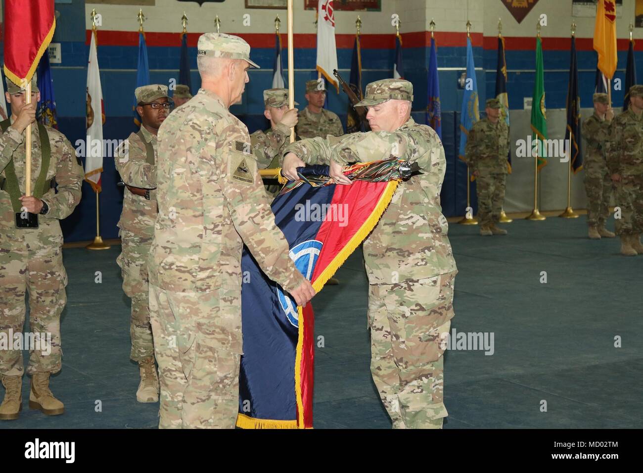 CAMP ARIFJAN, Kuwait – Maj. Gen. Victor Braden (left), 35th Infantry Division commanding general, and Command Sgt. Maj. Timothy Newton case the division’s colors during a transfer of authority ceremony March 8, 2018. The headquarters battalion of the 28th Infantry Division, Pennsylvania Army National Guard, assumed responsibility for Task Force Spartan and will serve as a division headquarters for roughly 10,000 soldiers conducting theater security operations in the Middle East. The 35th Infantry Division is comprised of soldiers from the Missouri and Kansas National Guard. (U.S. Army photo by Stock Photo