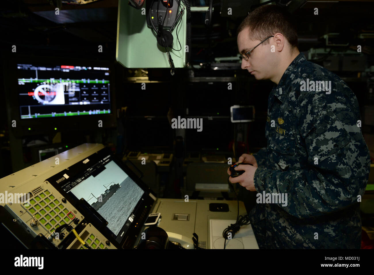 180302-N-LW91-032 GROTON, Conn. (Feb.02, 2018) Lt. jg. William Gregory uses  a XBOX game controller to maneuver the photonic mast aboard  Pre-commissioning Unit Colorado (SSN 788) during a tour of the Colorado.  Colorado