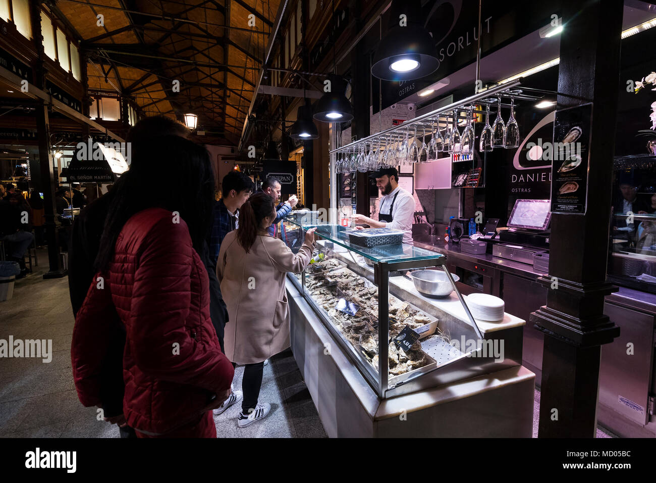 MADRID, SPAIN - 28 MARCH, 2018: Evening market of San Miguel serving customers. Stock Photo