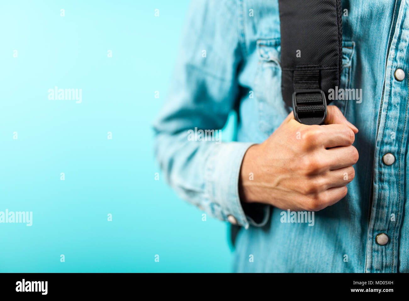 Man holding a backpack Stock Photo Alamy