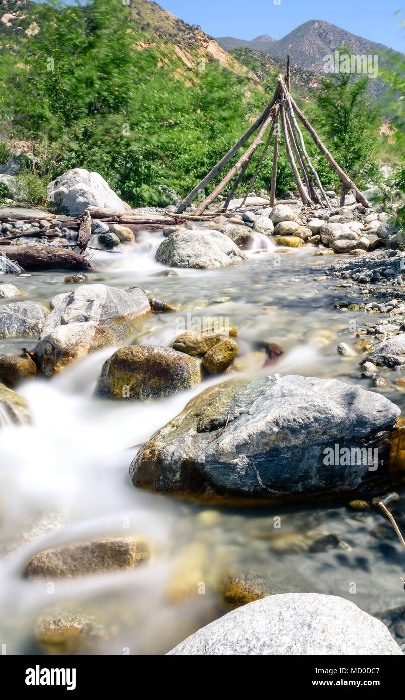 A small mountain creek in the southern California mountains.  Long Exposures smooth the water over the rocks. Stock Photo