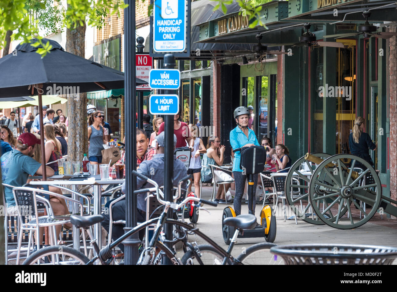 Active senior leading a Segway tour in historic Uptown Columbus, Georgia. (USA) Stock Photo