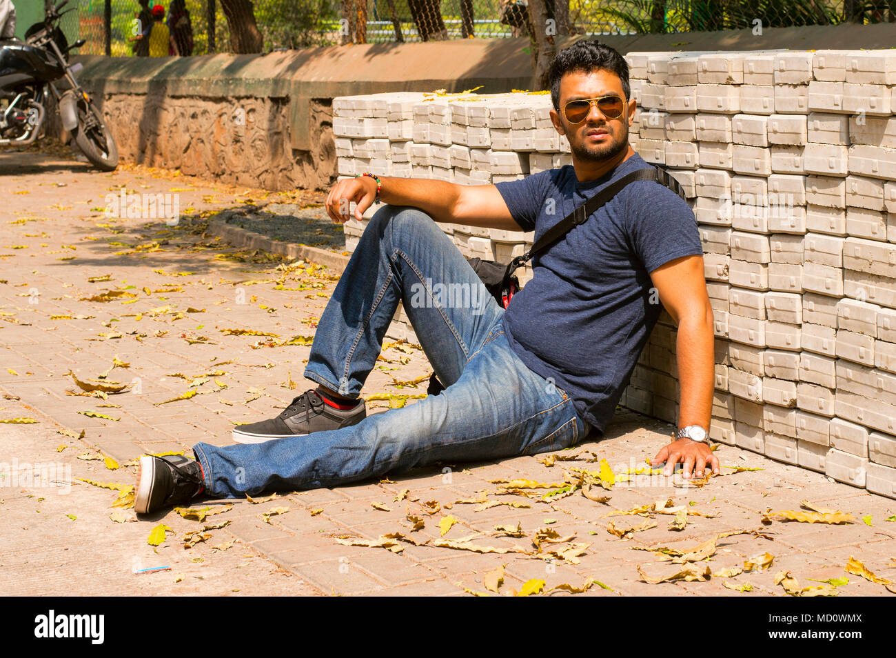 photo Male Model Poses Sitting Down https www alamy com stock photo adult male model wearing jeans html