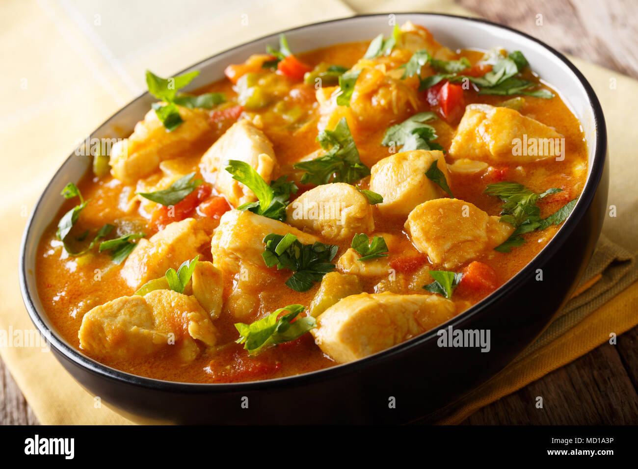 Brazilian typical food Bobo chicken with yuca and pepper in coconut milk close-up in a bowl. horizontal Stock Photo