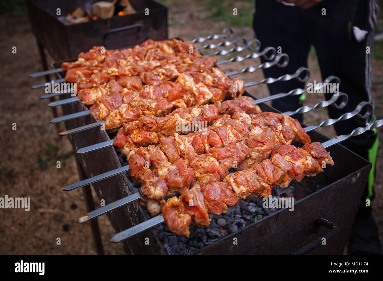 Delicious barbecue kebab grilling on open grill Stock Photo - Alamy