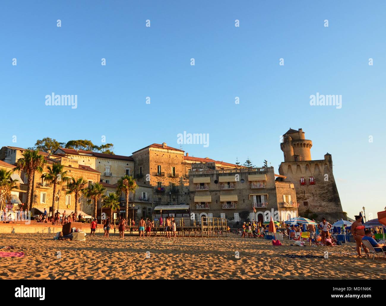 Santa Maria di Castellabate, Campania region, Italy August 15 2016. The  main beach overlooked by the tower of Il Palazzo Belmonte Stock Photo -  Alamy