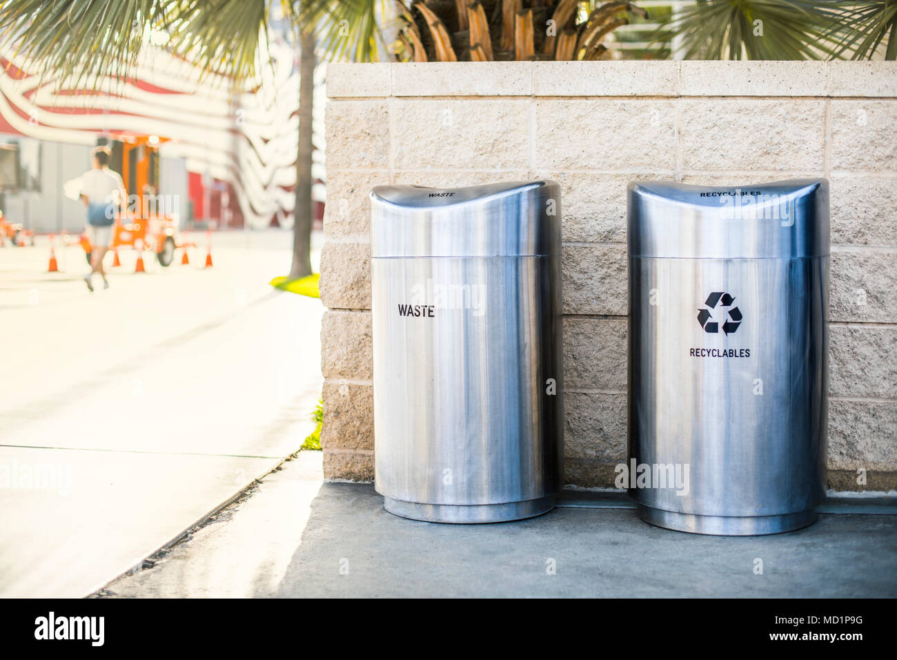 Separate garbage bins for recycled trash and waste installed on a