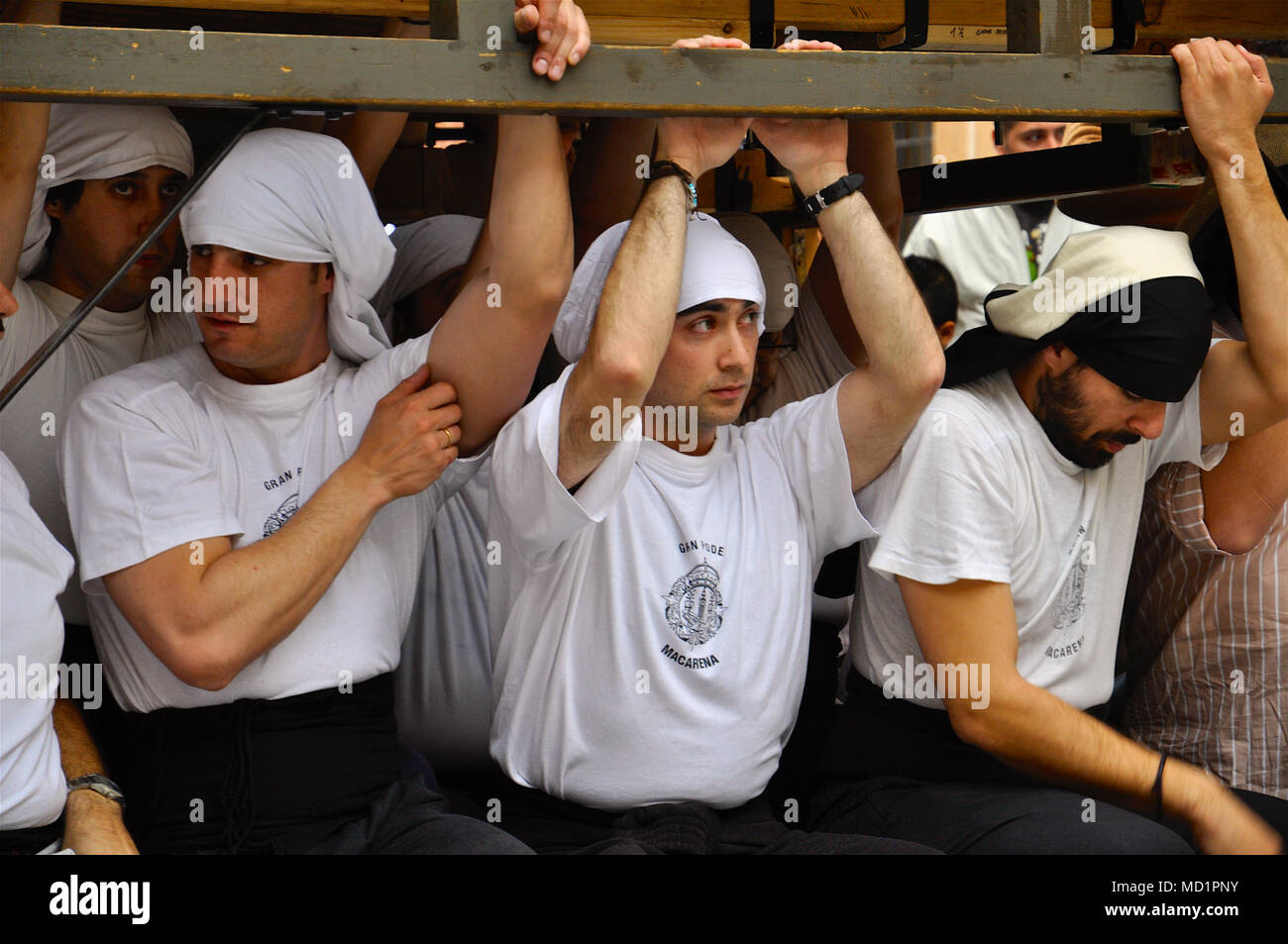 Gran Poder and Macarena brotherhood cofrades taking a rest in “Paso” carriage practices for the Holy Week in Madrid old town (Spain) Stock Photo