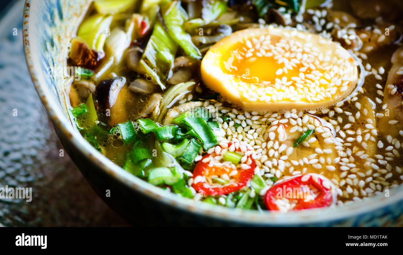 Ramen Soup in Bowl. Rich flavour chicken broth with Miso paste, grilled  teriyaki chicken, leeks, mushrooms, pickled eggs, egg noodles, onion, chili  pe Stock Photo - Alamy