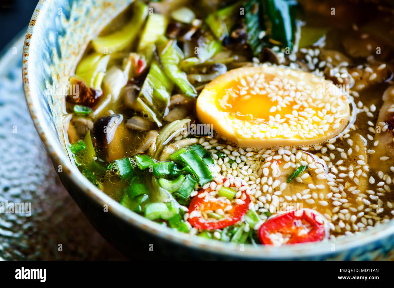 Ramen Soup in Bowl. Rich flavour chicken broth with Miso paste, grilled  teriyaki chicken, leeks, mushrooms, pickled eggs, egg noodles, onion, chili  pe Stock Photo - Alamy