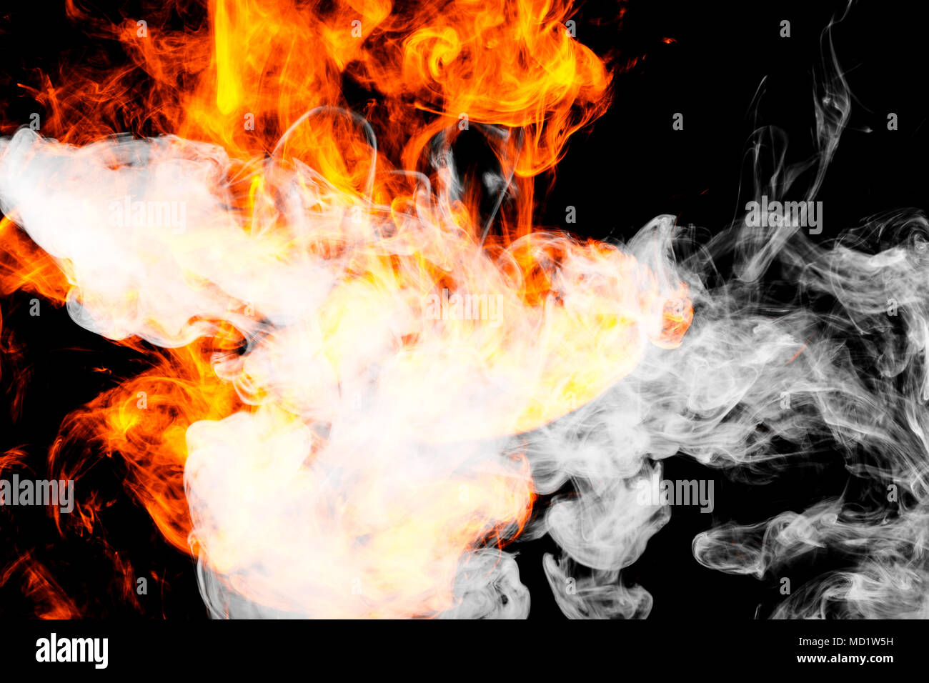 Fire flames background. Cloud of fiery smoke on a black isolated  background. Background from the smoke of vape Stock Photo