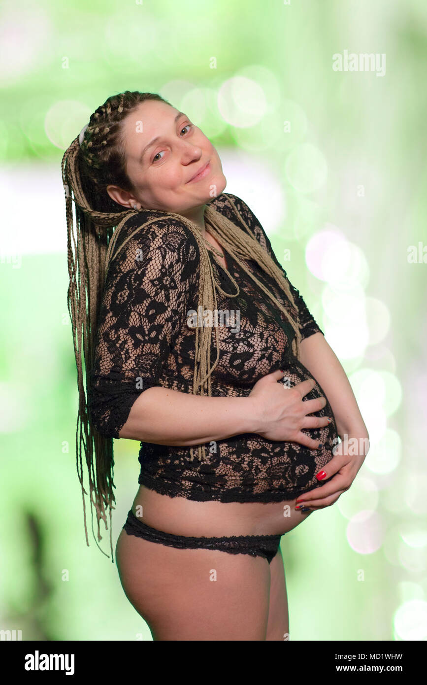 Pregnant Woman Holding Abdomen Stock Photo