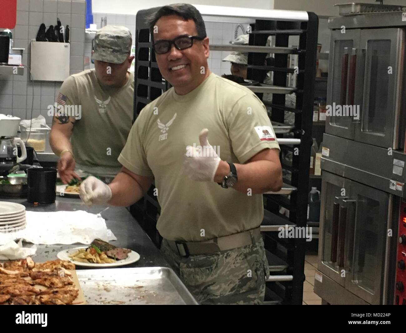 Cordon-Bleu-trained Chef Senior Master Sgt. Neil Bulatao prepares meals with other 146th Airlift Wing Services Flight staff during Health and Wellness Week--a new concept developed as part of the wing's focus on fitness this year. (U.S. Air National Guard photo by Maj. Kimberly Holman) Stock Photo