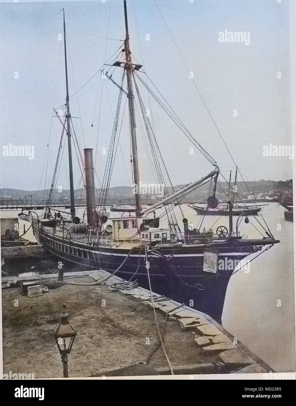 Heliotype print of the dredger USS Blake at Washington Navy Yard, New York City, New York, 1877. Note: Image has been digitally colorized using a modern process. Colors may not be period-accurate. () Stock Photo