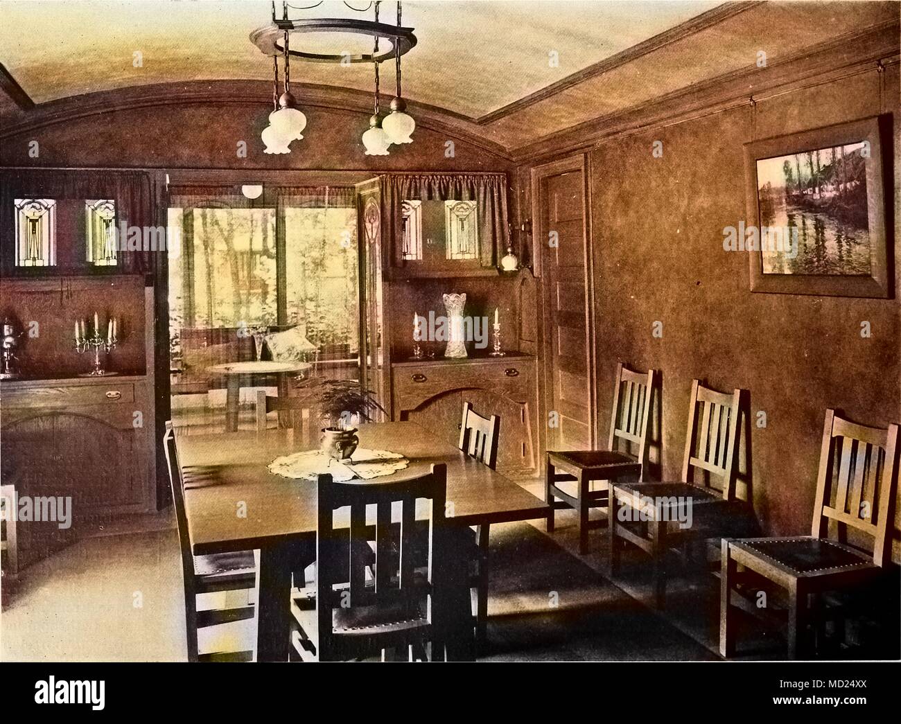 Photoengraving of the dining room interior in a house designed by George W. Maher, Kenilworth, Illinois, 1905. Courtesy Internet Archive. Note: Image has been digitally colorized using a modern process. Colors may not be period-accurate. () Stock Photo