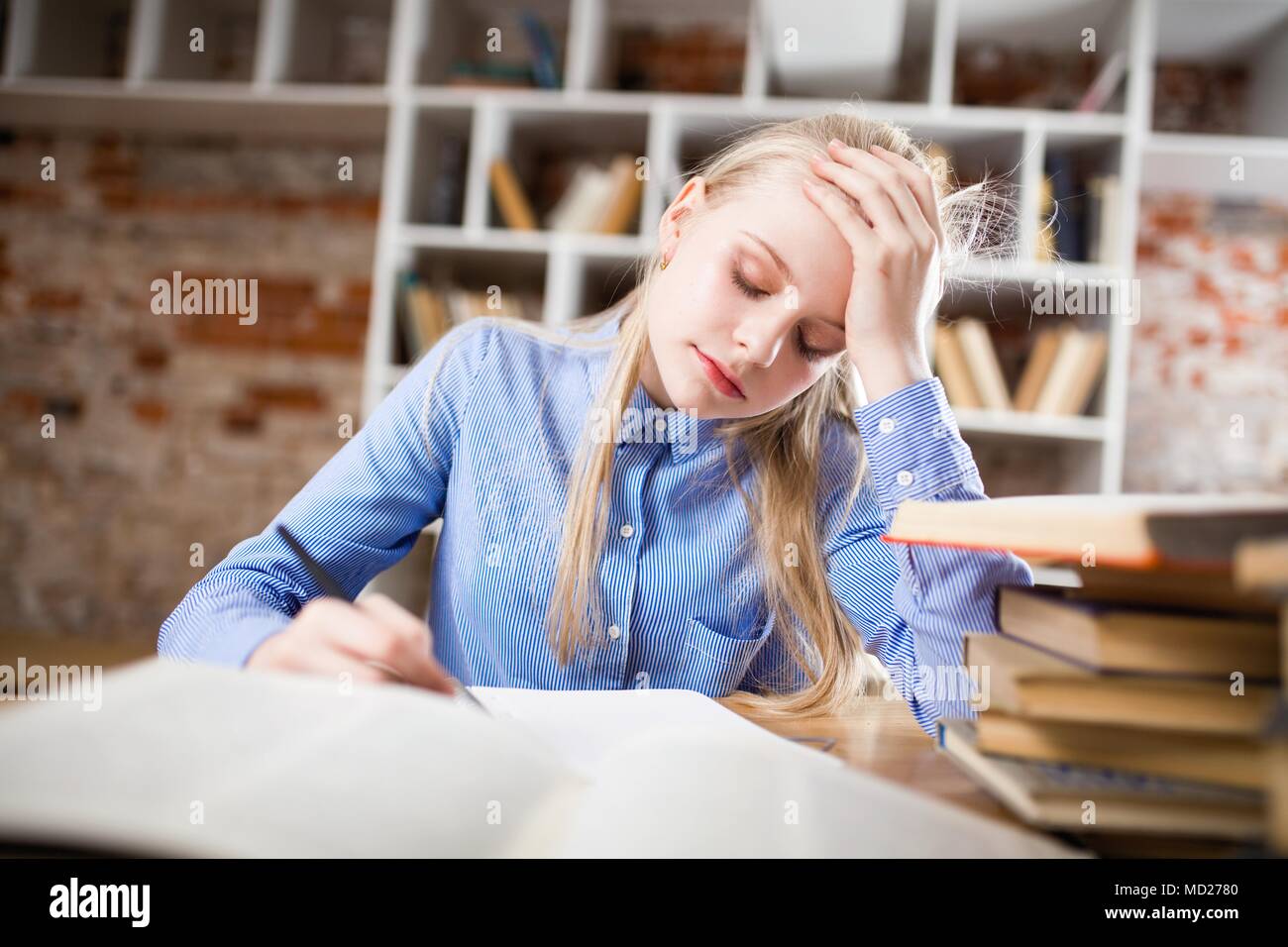 Teenage girl in a library Stock Photo
