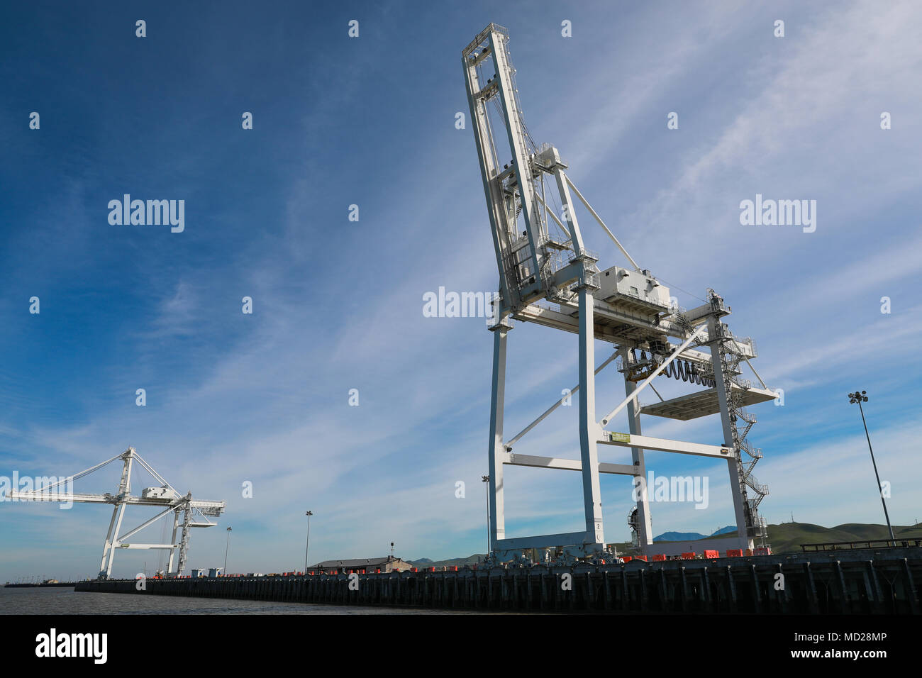 Gantry Cranes at Military Ocean Terminal Concord, California, Mar. 6, 2018. Trans Mariner 18 West is a real-world strategic mission utilizing U.S. Army Reserve and Active component Soldiers to conduct Port Operations allowing Army materiel and munitions containers for travel onward.  (U.S. Army photo by Sgt. Eben Boothby) Stock Photo
