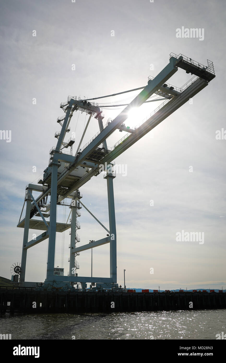 Gantry Crane at Military Ocean Terminal Concord, California, Mar. 6, 2018. Trans Mariner 18 West is a real-world strategic mission utilizing U.S. Army Reserve and Active component Soldiers to conduct Port Operations allowing Army materiel and munitions containers for travel onward.    (U.S. Army photo by Sgt. Eben Boothby) Stock Photo