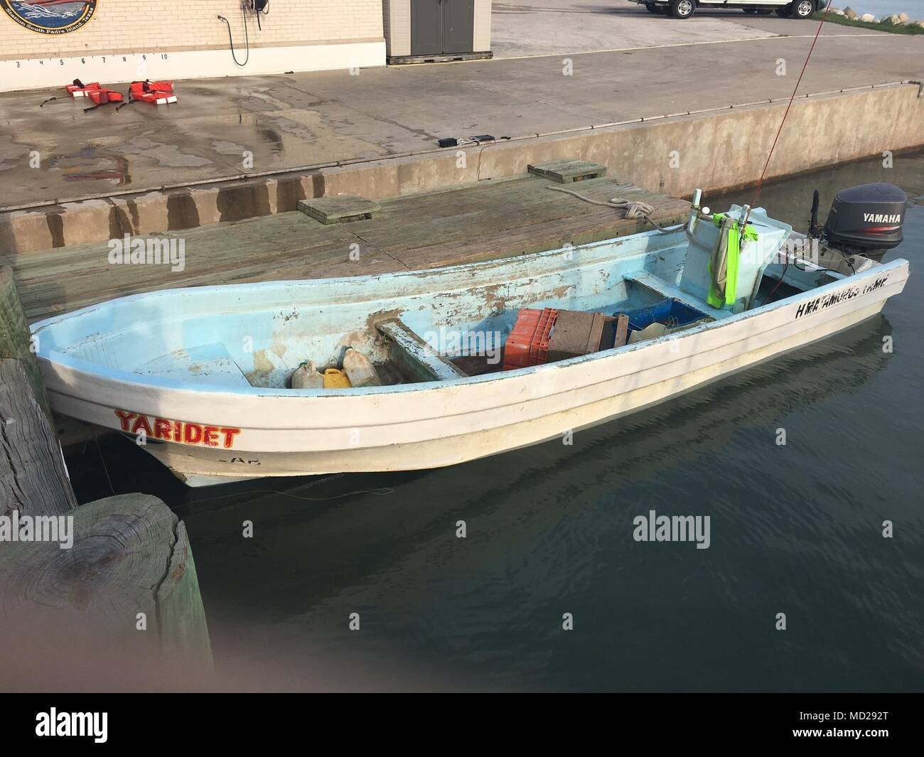A lancha boat floats by a pier in southern Texas waters after its seizure  by Coast Guard law enforcement crews on Mar. 11, 2018. Lanchas are  frequently used to transport illegal narcotics