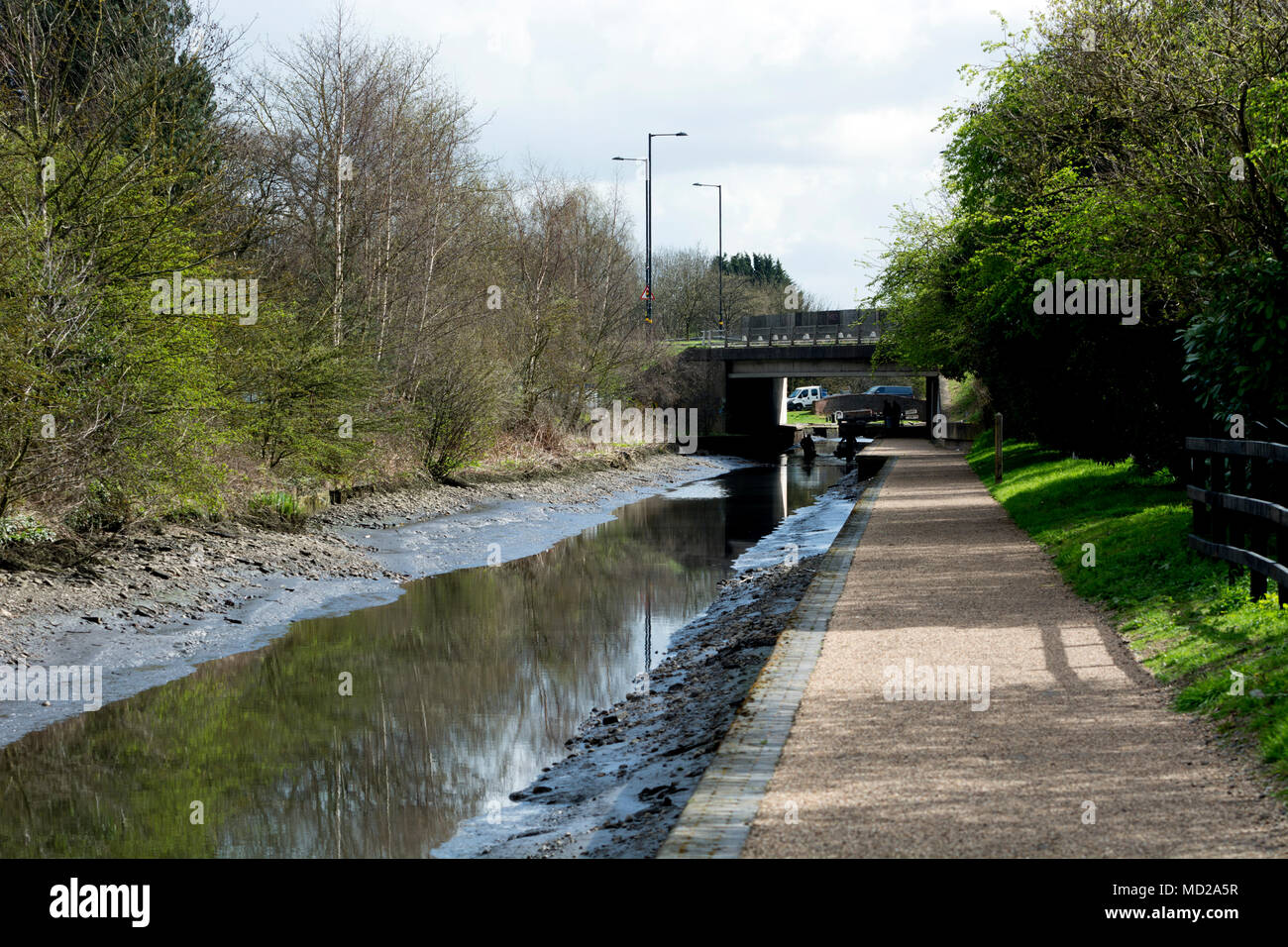 The drained Birmingham and Fazeley Canal near the A38 flyover, Minworth, West Midlands, UK Stock Photo