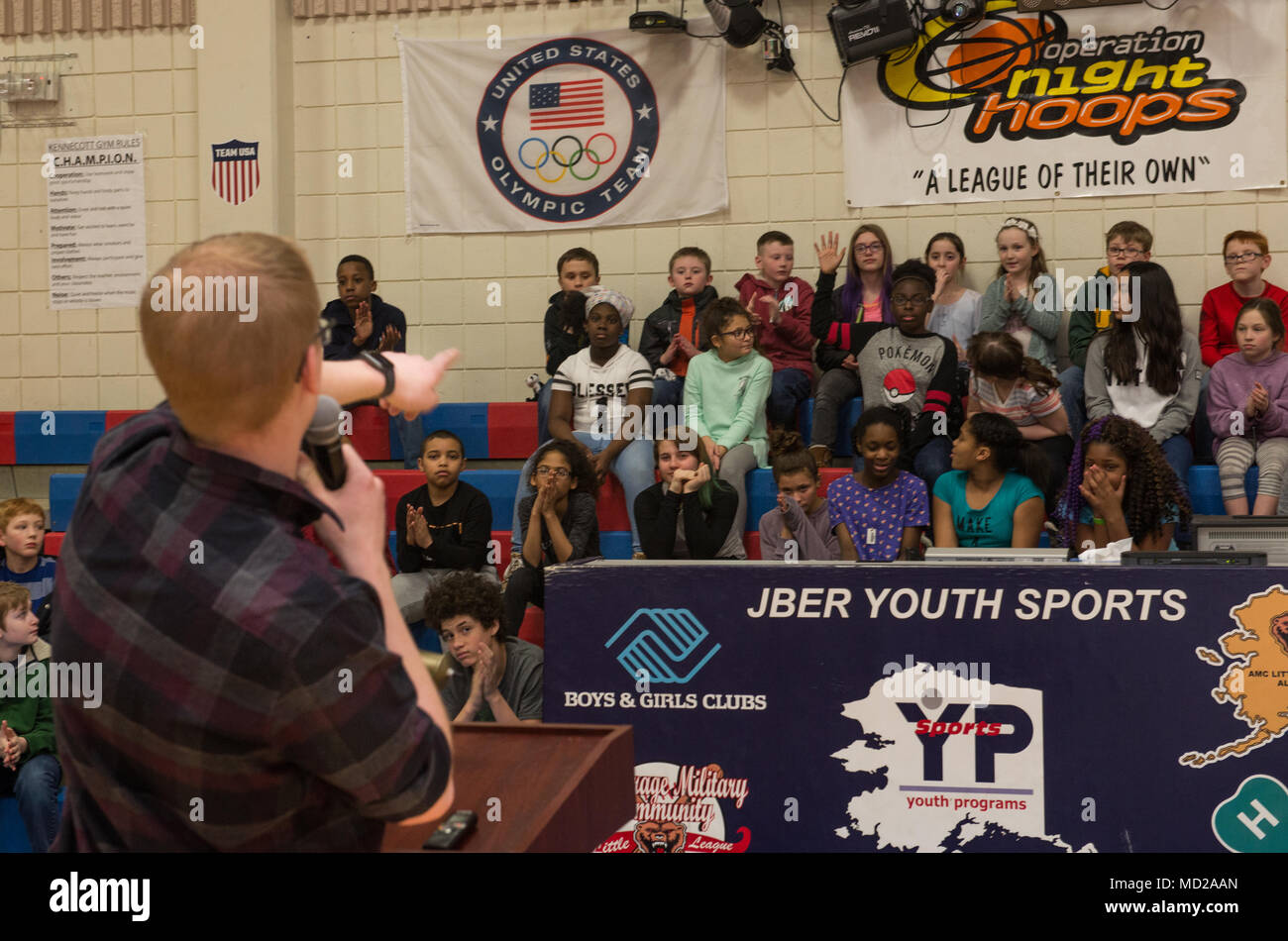 Jon Peterson speaks to children about the power of education at the