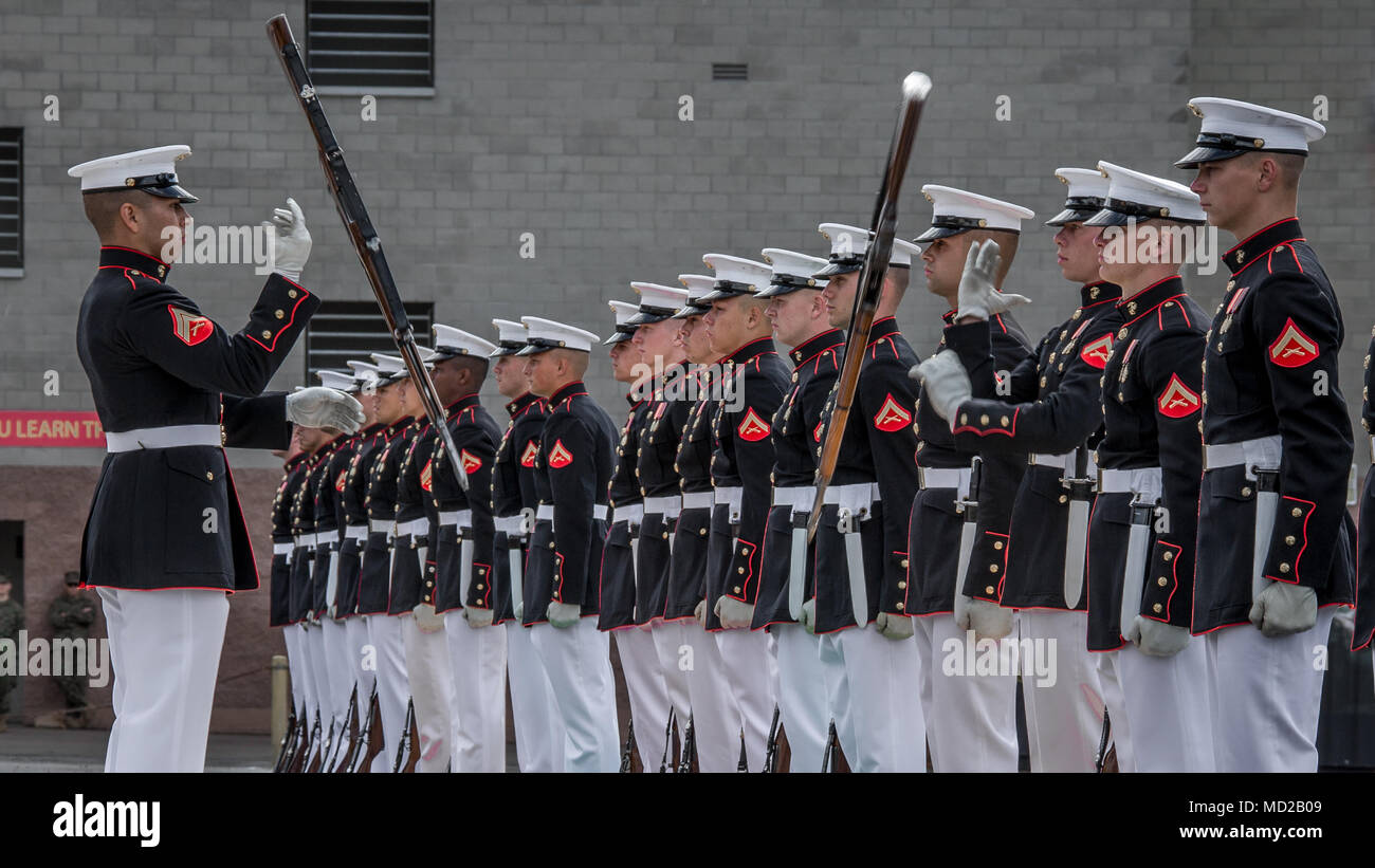 U.S. Marines with the Silent Drill Platoon with the Battle Color Detachment, perform during the Battle Color ceremony at Marine Corps Base Camp Pendleton, Calif., March 15, 2018. The ceremony featured the platoon, 'The Commandant's Own,' the United States Marine Drum and Bugle Corps and the Marine Corps Color Guard. (U.S. Marine Corps photo by Lance Cpl. Rhita Daniel) Stock Photo