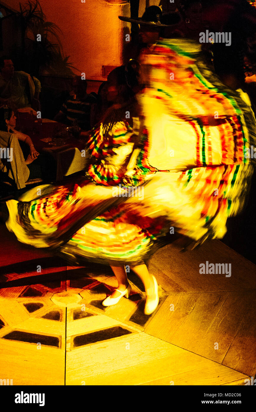 Mexican ranchera dancer woman in regional dress performs at Focolare Restaurant, first opened in 1953 on the premises of an old traditional hacienda h Stock Photo