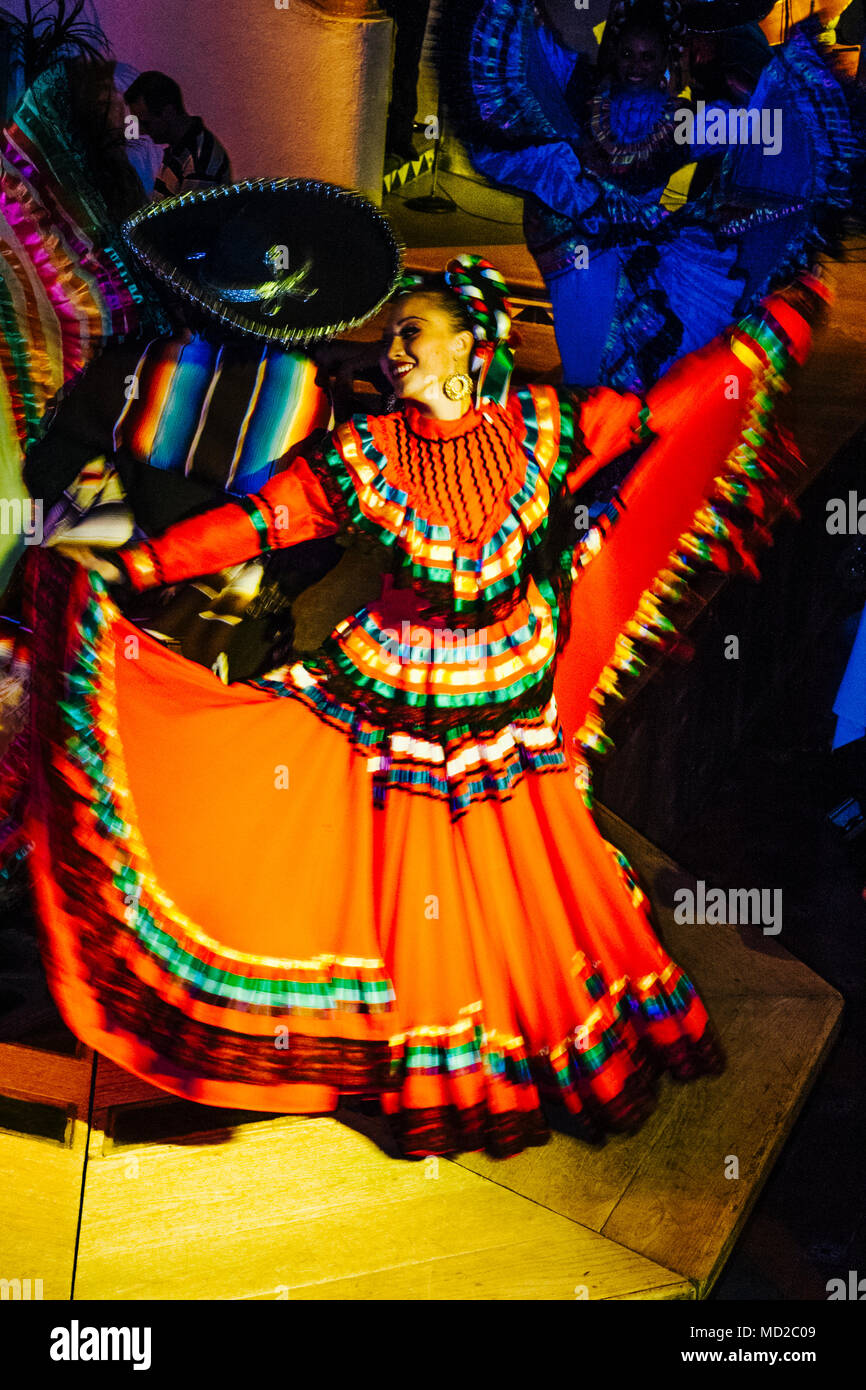 A couple of Mexican ranchera dancers performs at Focolare Restaurant, first opened in 1953 on the premises of an old traditional hacienda house in the Stock Photo