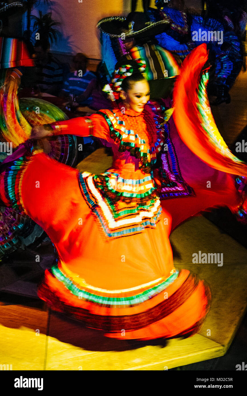 Mexican woman ranchera dancer in regional dress performs at Focolare Restaurant, first opened in 1953 on the premises of an old traditional hacienda h Stock Photo