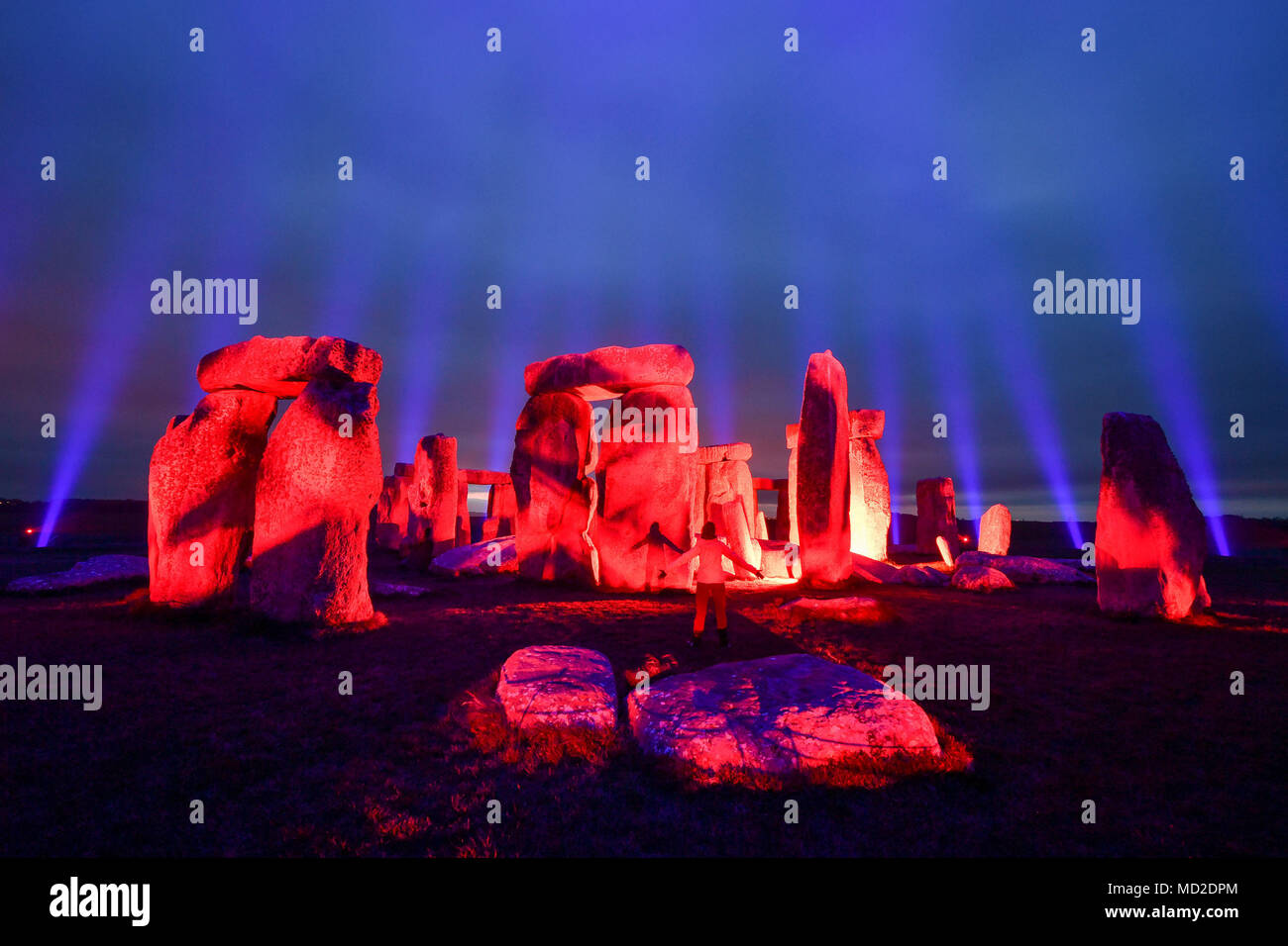 Stonehenge in Wiltshire is lit up by Finnish light artist Kari Kola to mark UNESCO World Heritage Day and as part of activities to mark 100 years of care and conservation to the prehistoric monument. Stock Photo